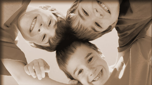 three boys smiling